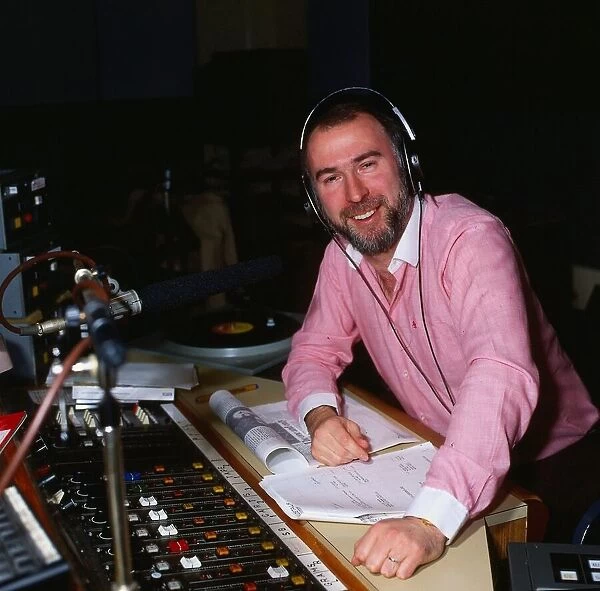 Ken Bruce DJ disc jockey in radio studio circa 1984