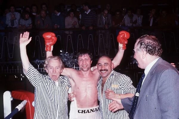 Ken Buchanan boxer arms raised after win with seconds in ring