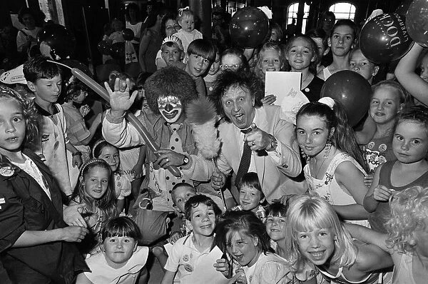 Ken Dodd joins forces with Jimbo the clown and the kids at the Albert Dock