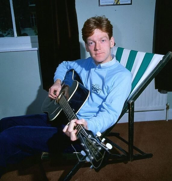 Kenneth Branagh actor director 1985 playing guitar