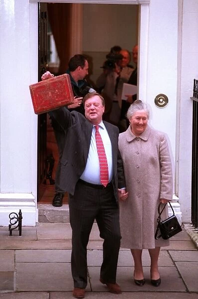Kenneth Clarke MP chancelor of the exchequer with his wife Gillian Clarke stand outside