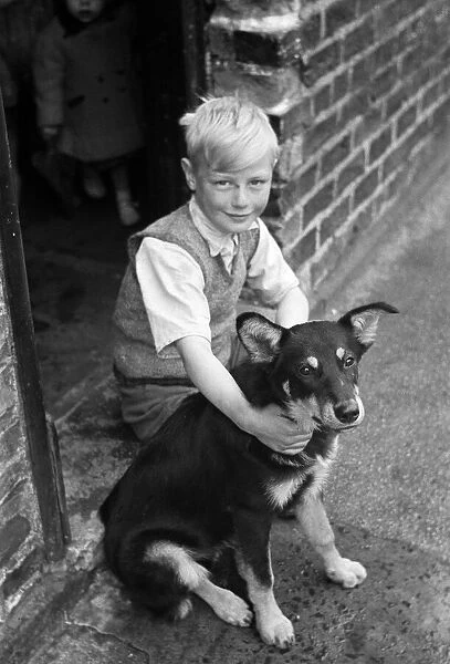 Kenneth Griffiths, pictured at home with Lassie, the dog he took with him on his