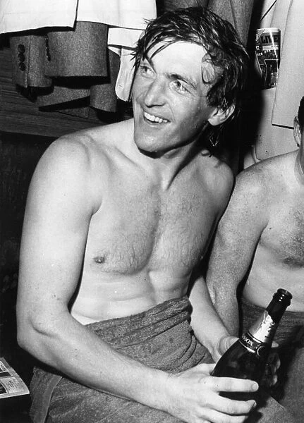 Kenny Dalglish celebrates with champagne in the dressing room