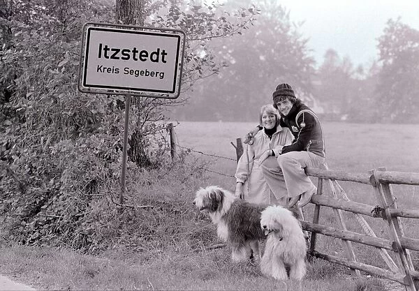Kevin Keegan Football star with his wife in Germany. Old English sheep dogs