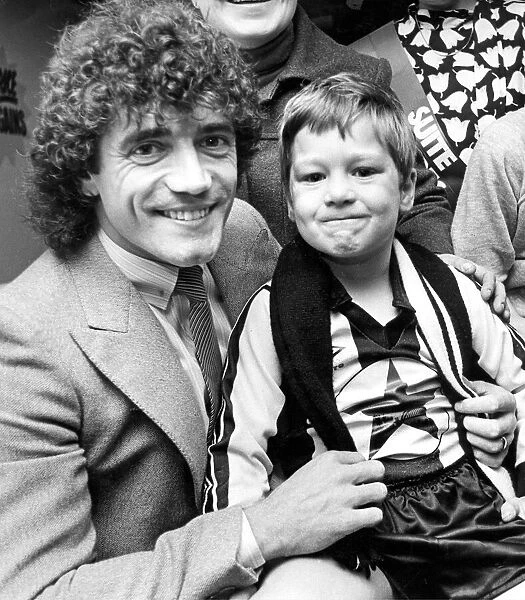 Kevin Keegan with five year old Robert Robertson at a furniture store opening