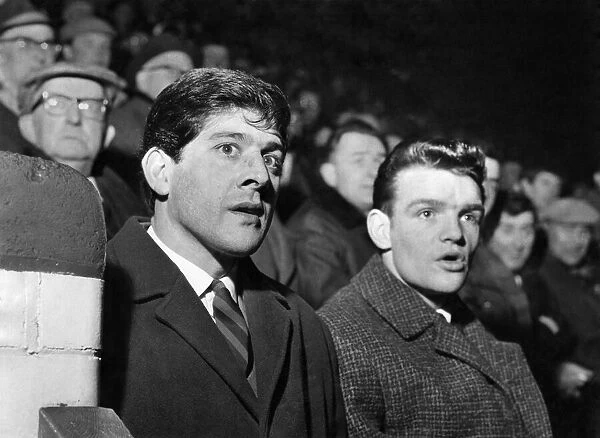 Kevin Keelan the Norwich goalie and Hugh Curran who is injured watching the Stockport v