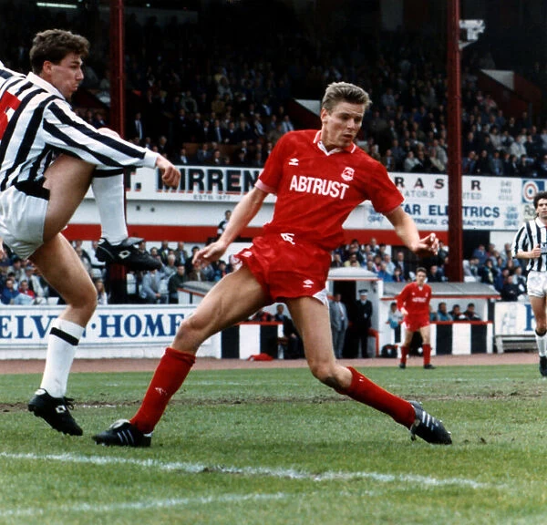 Kevin McGowne football player for St Mirren defends goal from Willem van der Ark of