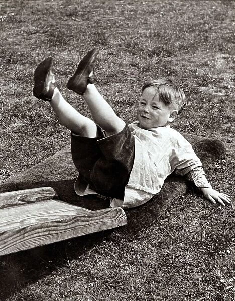 Kid playing in the garden, circa 1950