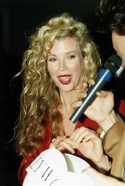 Kim Basinger Actress being interviewed by man with microphone A©Mirrorpix