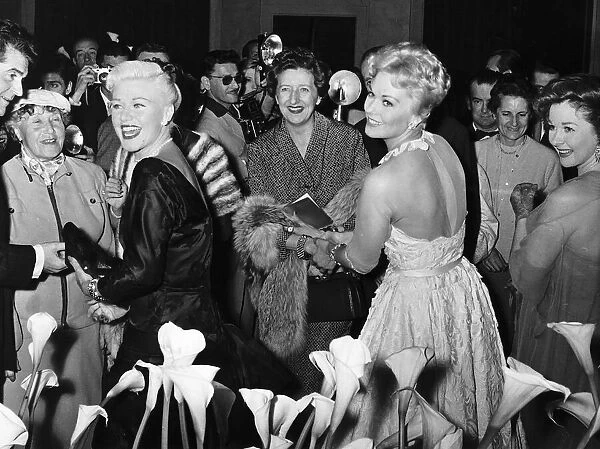 Kim Novak actress and Ginger Rogers actress signing autographs at the Cannes Film