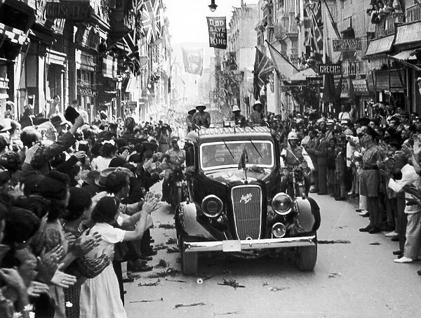 King George VI cheered by waving crowds on the streets of Valetta as he visits