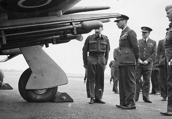 King George VI inspecting the latest Typhoon aircraft fitted with rocket projectile