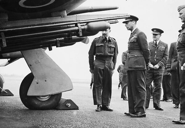 King George VI inspecting the latest Typhoon aircraft fitted with rocket projectile