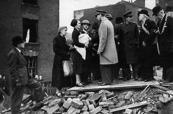 King George VI meets residents of a bombed street during his visit to the city of