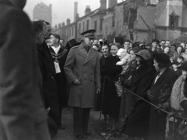 King George VI tours the bomb shattered areas of Birmingham following the city suffering