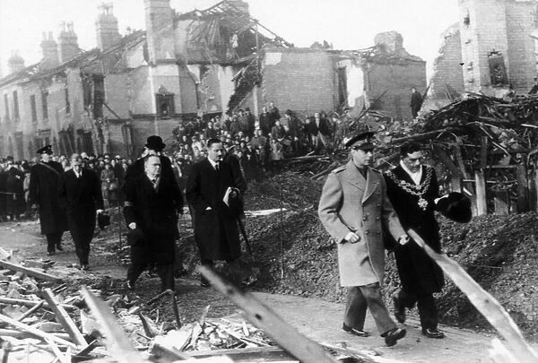 King George VI visits the bomb damaged city of Birmingham following an air raid