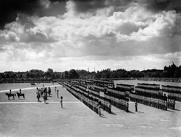 The King presents new colours. The King inspecting the Guards in Hyde Park where he