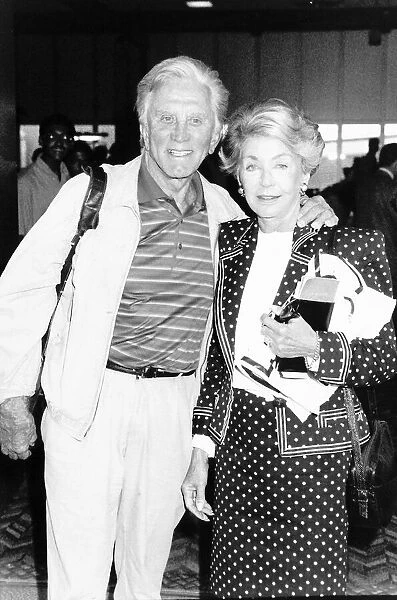 Kirk Douglas actor and wife Anne leave from Heathrow Airport Dbase
