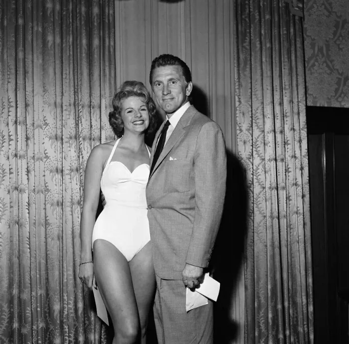 Framed Print : Kirk Douglas selects 21-year-old Marilyn Davies as the winner of the Viking Beauty