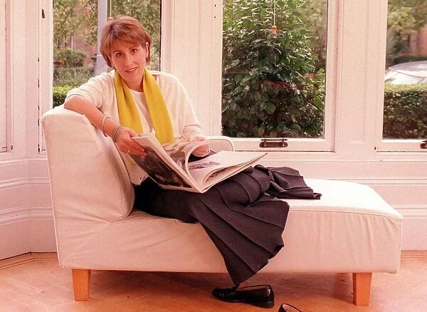 Kirsty Wark October 1999 TV Presenter reading a book on a sofa in her home