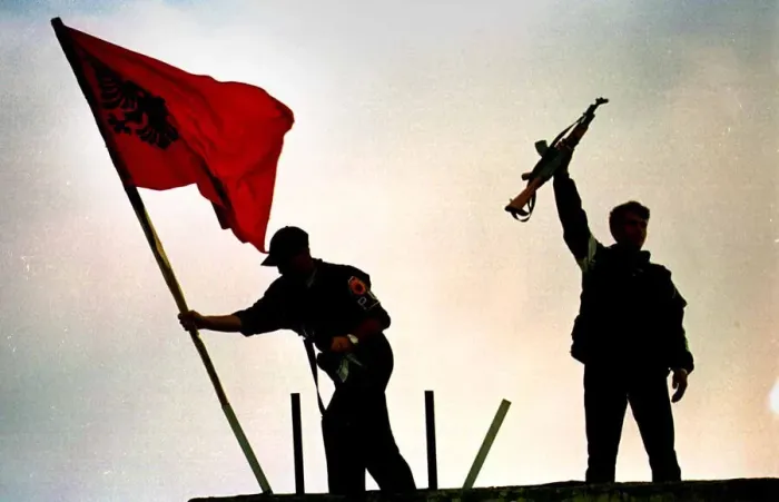 Framed Print : KLA soldiers place flag above a building in Pristina June 1999 PIC BY CHRIS WATT