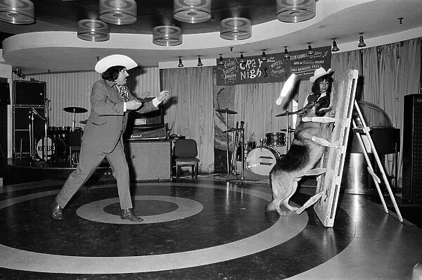 A knife throwing act which uses a dog as part of its show. 1972