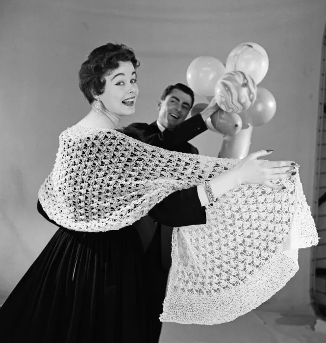Framed Print : Knitted stole modelled by Jackie Jackson with Michael Bentley in background. July 1955