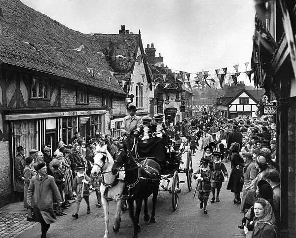 Knutsford May Festival. The royal coach passing through the street of Knutsford en route