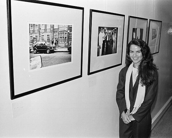 Koo Stark, Actress poses next to a print taken by herself
