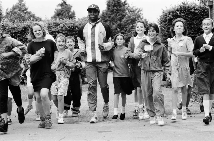 Framed Print : Kriss Akabusi at Geoffrey Field School, Reading. 8th July 1991 Framed Print : Kriss Akabusi at Geoffrey Field School, Reading. 8th July 1991