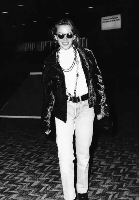 : Kylie Minogue singer actress in dark glasses and leather jacket at Heathrow Airport : Kylie Minogue singer actress in dark glasses and leather jacket at Heathrow Airport