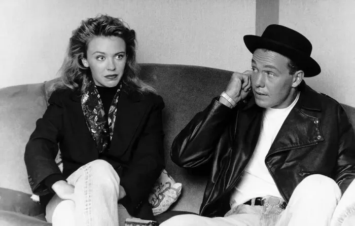 Framed Print : Kylie Minogue singer actress with Jason Donovan singer actor sitting on sofa Framed Print : Kylie Minogue singer actress with Jason Donovan singer actor sitting on sofa