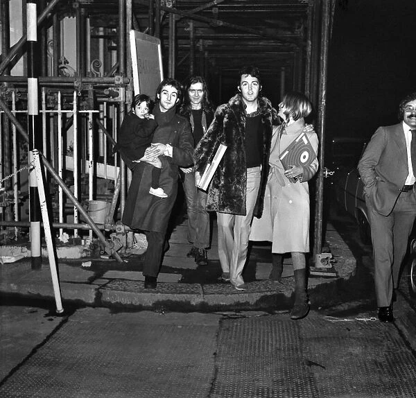 L-R Mary McCartney being carried by Benny Lane, Billy McCaldrey, Paul and Linda McCartney