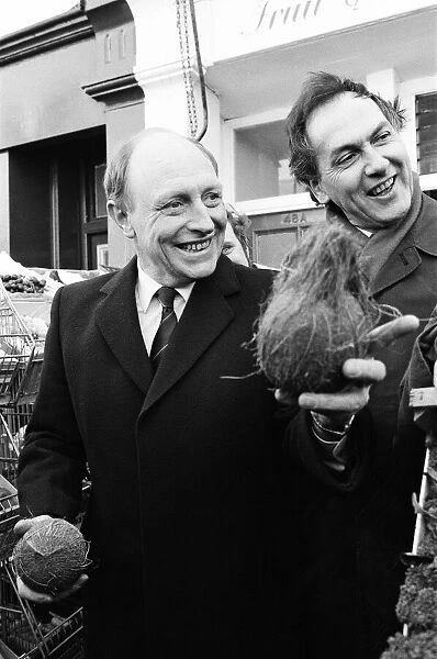 Labour leader Neil Kinnock juggles with produce at a market in Wandsworth, London