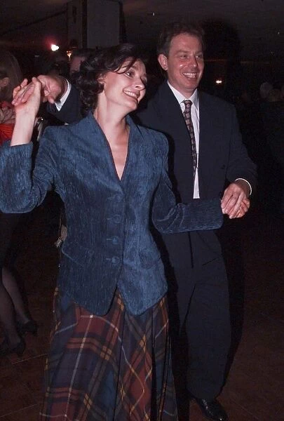 Labour leader Tony Blair and wife Cherie Blair dance together at the party