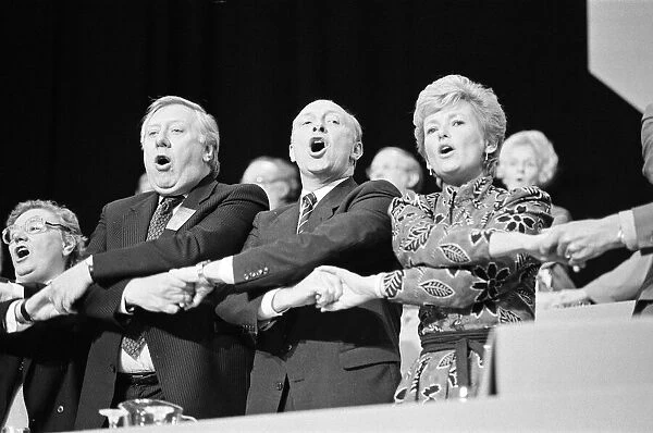 The Labour Party Conference, Brighton. Leader Neil Kinnock links arms with his wife