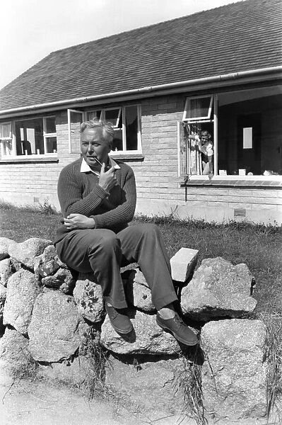 Labour Party leader Harold Wilson on holiday outside his cottage at St