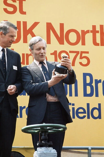 Labour Secretary of State for Energy Tony Benn pictured with bottle of oil