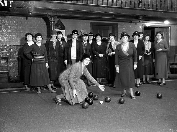 Ladies of the Crown Green Bowls team seen here playing on a covered over swimming pool
