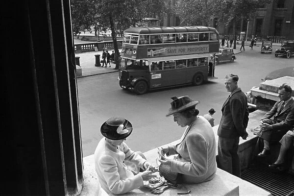 Ladies eating their packed lunch in Trafalgar Square, London, 26th August 1946