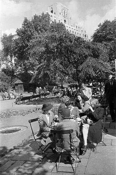 Ladies enjoying afternoon tea in Victoria Gardens on the Embankment, London