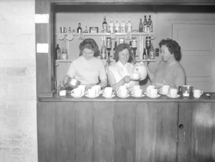 Framed Print : Ladies pour the tea, ready for the rush at half-time during the Motoball match