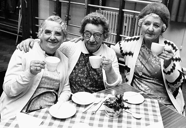Three ladies seen here enjoying a nice cup of tea after their Christmas party
