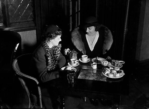 Two ladies taking afternoon tea. c. 1930