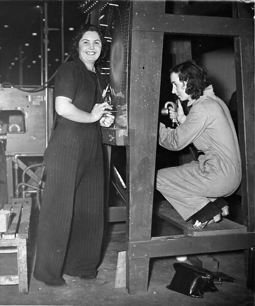 Two ladies (un named) working in a Fighter Aircraft Factory in The Midlands