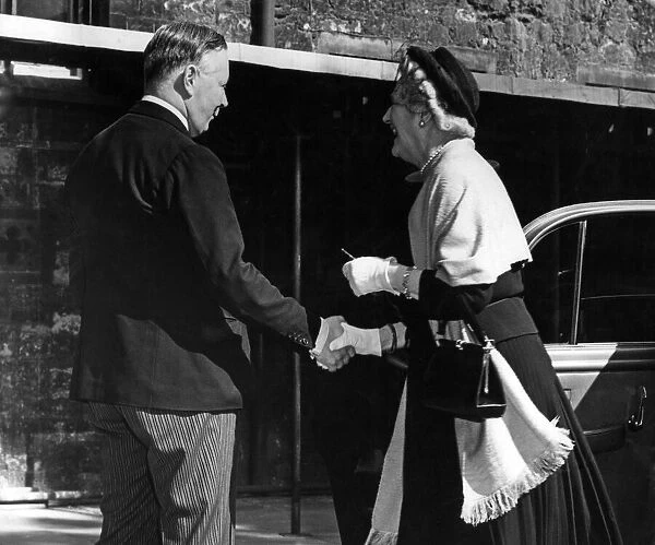 Lady Churchill greeted by the Duke of Norfolk on her arrival at Westminster Abbey for a