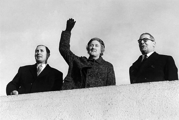 Lady Dorothy Macmillan, wife of the Prime Minister, waves as the comet with the Prime