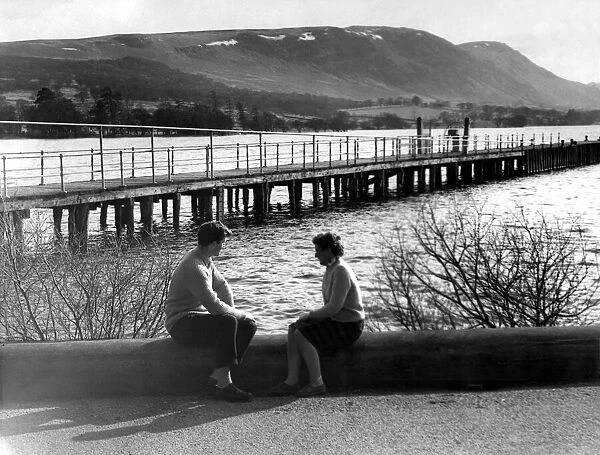 Lake District - A couple sit at the waters edge at Ullswater 19 March 1963