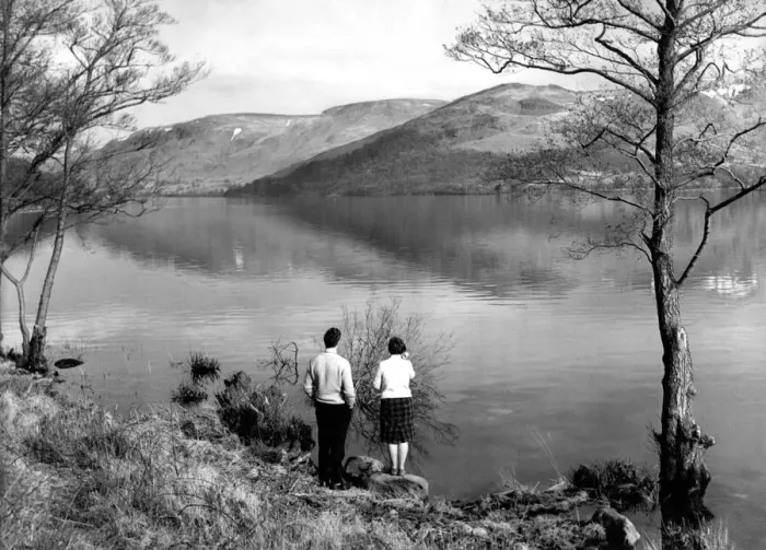 Framed Print : Lake District - A couple stand at the waters edge at Ullswater 19 March 1963 Framed Print : Lake District - A couple stand at the waters edge at Ullswater 19 March 1963