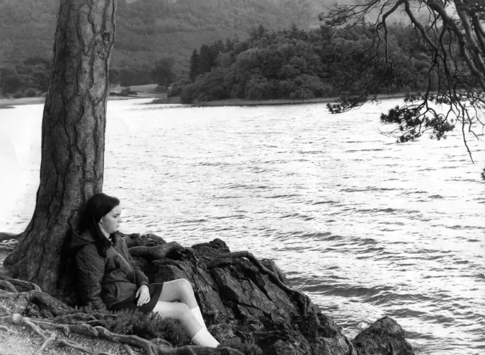 Framed Print : Lake District - Derwentwater - Friars Crag - A youngster sits by a tree Framed Print : Lake District - Derwentwater - Friars Crag - A youngster sits by a tree